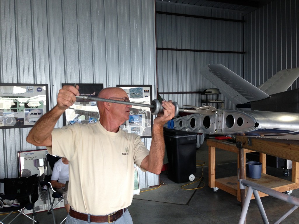 Ed Smith (Old Bull) removing wing hinge pins.